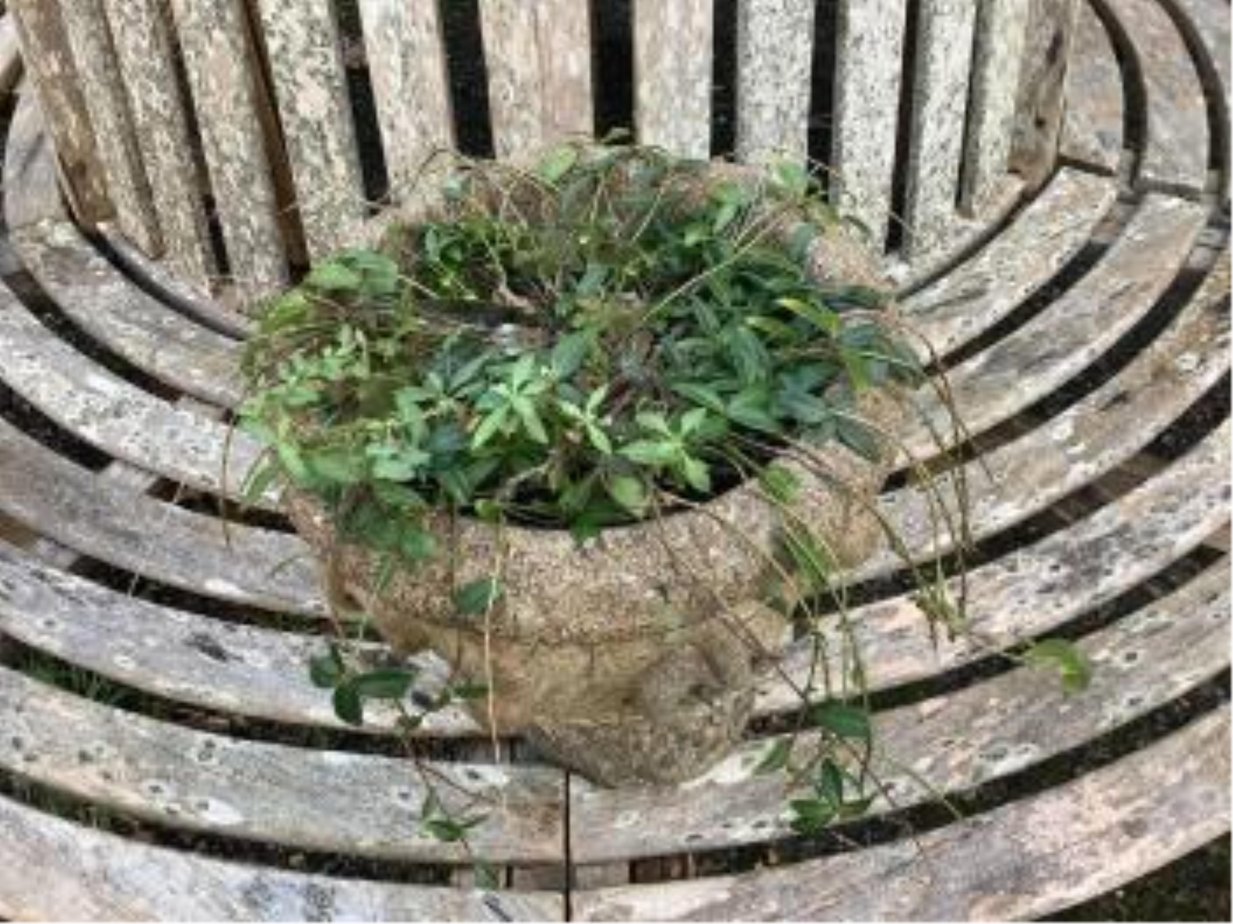 Three reconstituted stone circular garden planters and a square plinth. Condition - fair